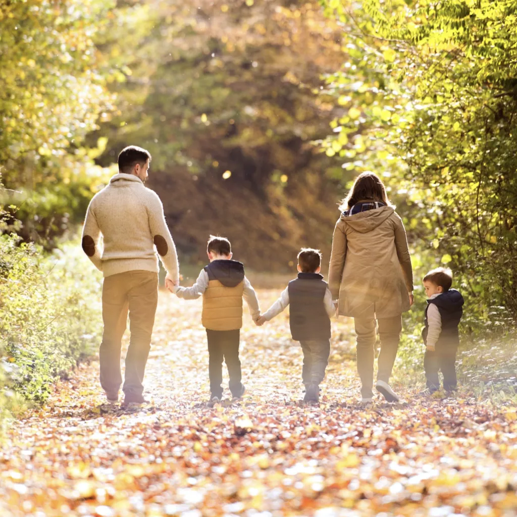 A family walking together hand in hand.