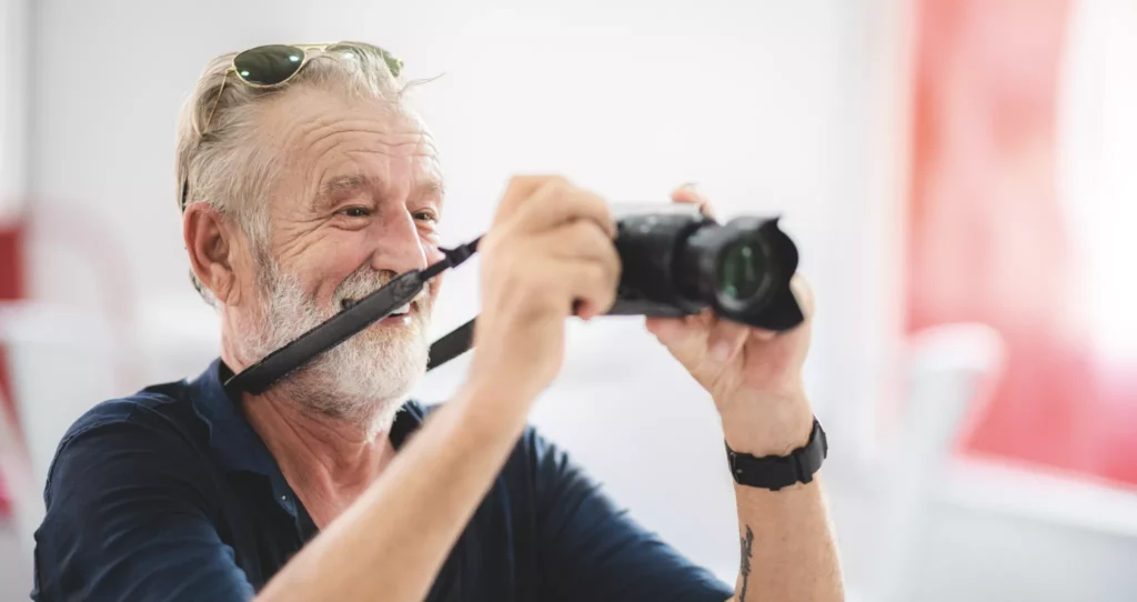 Senior man doing photography in retirement.