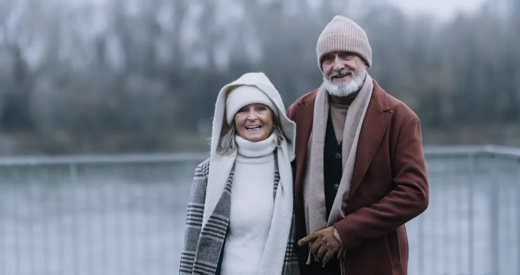 An elderly couple smiling