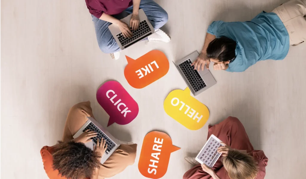 Group of people on laptops and tablets, using social media