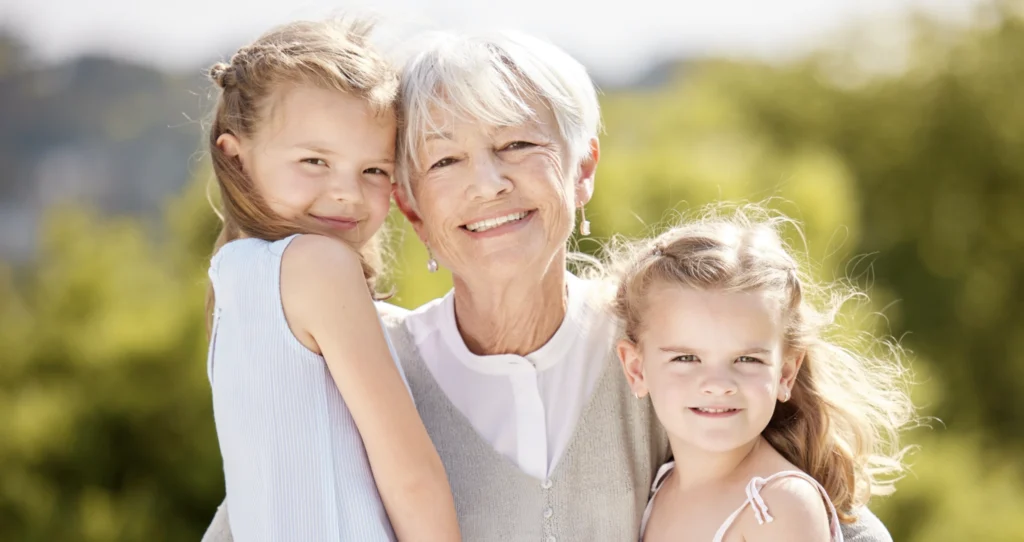 A grandmother with her two granddaughters