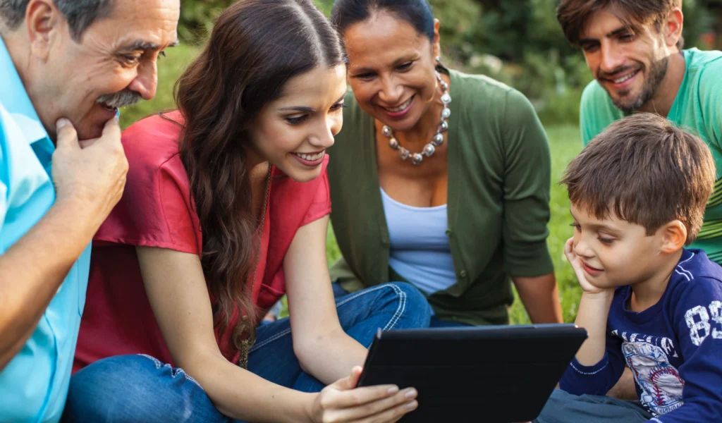 A family looking at their digital journal website on a tablet