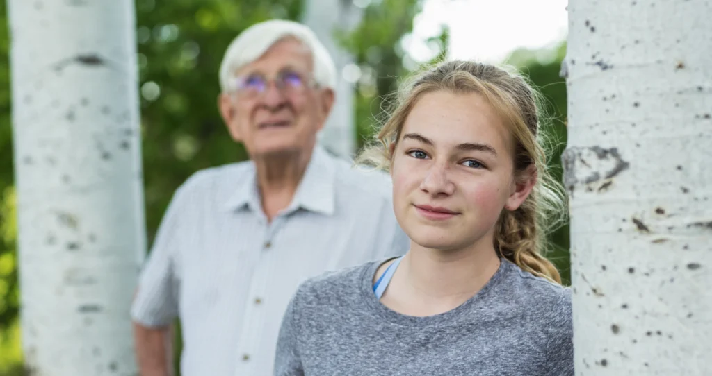 A teenage girl and her grandfather
