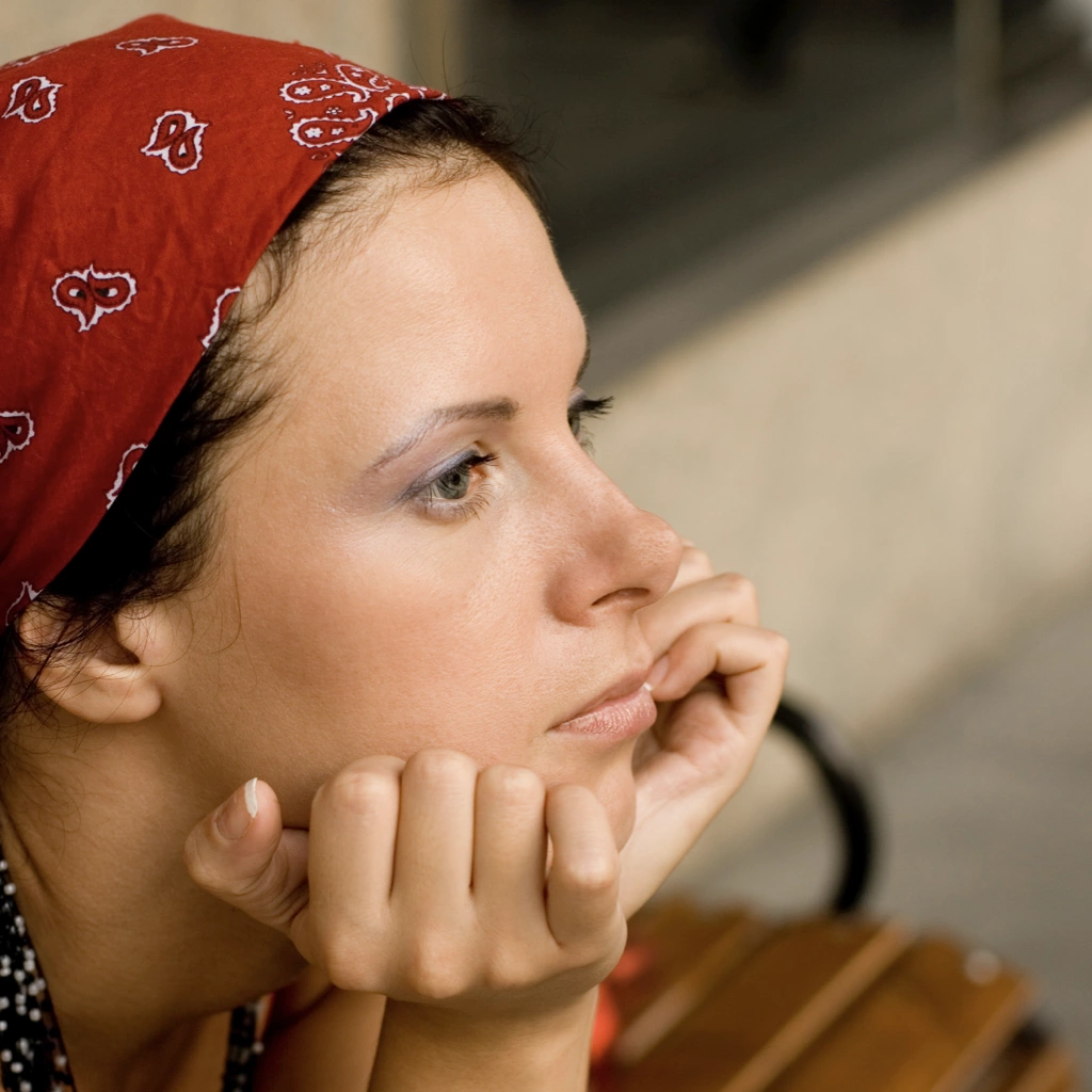 A lady sat deep in thought