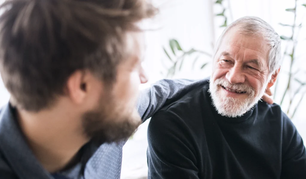 A son talking with his dad