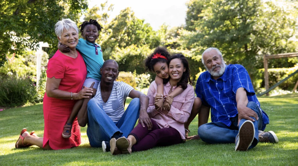 A multigenerational family sat in their garden