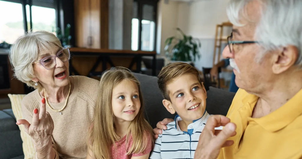 Grandparents sharing stories with their grandchildren about their lives