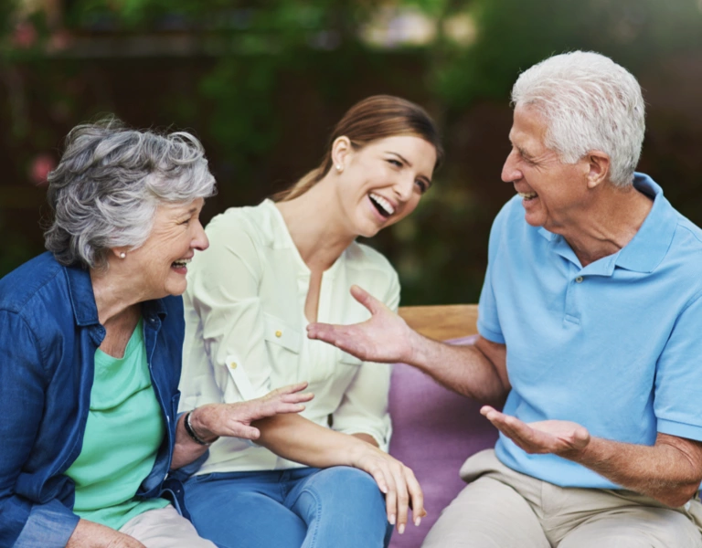 Senior parents talking with their daughter