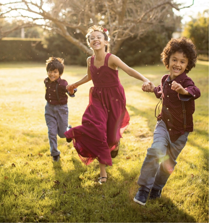 A recent photo of children running in the garden