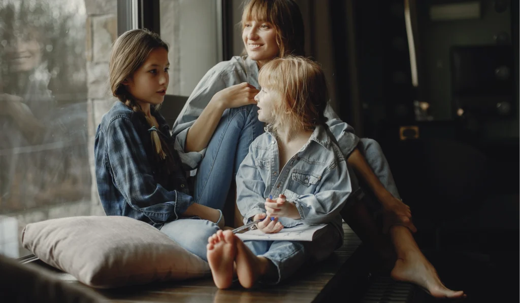 A family playing a conversation starter game on a rainy day.