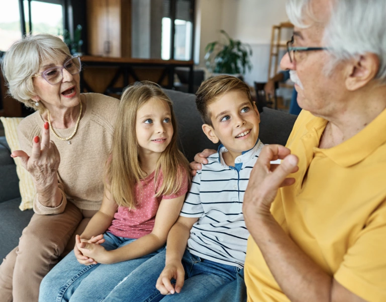 Grandparents sharing stories with their grandchildren