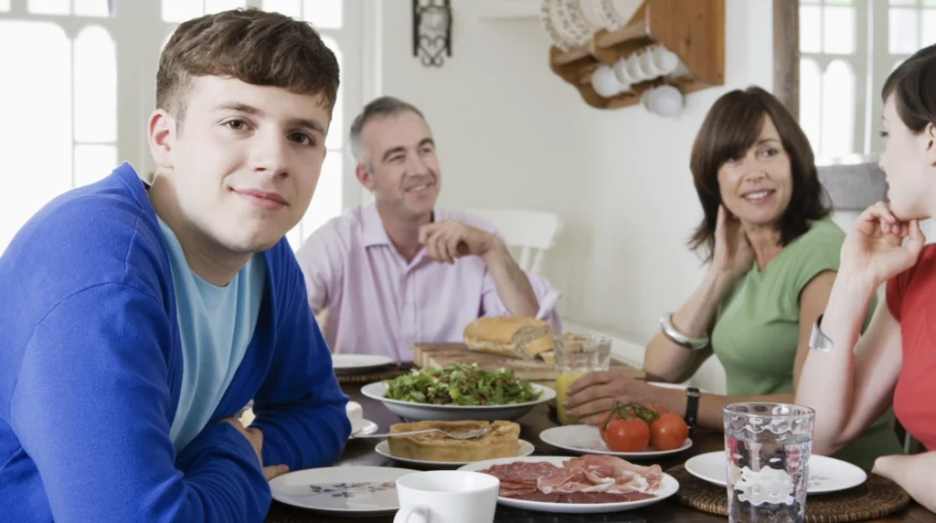 A teenager at the dinner table