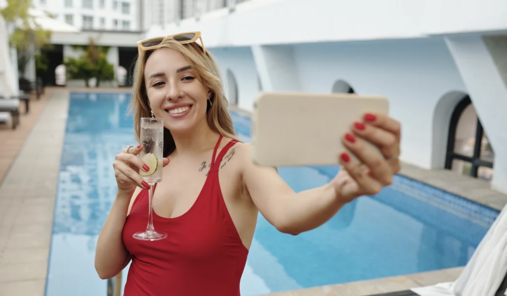 A social media influencer staging a photo in a luxury hotel 