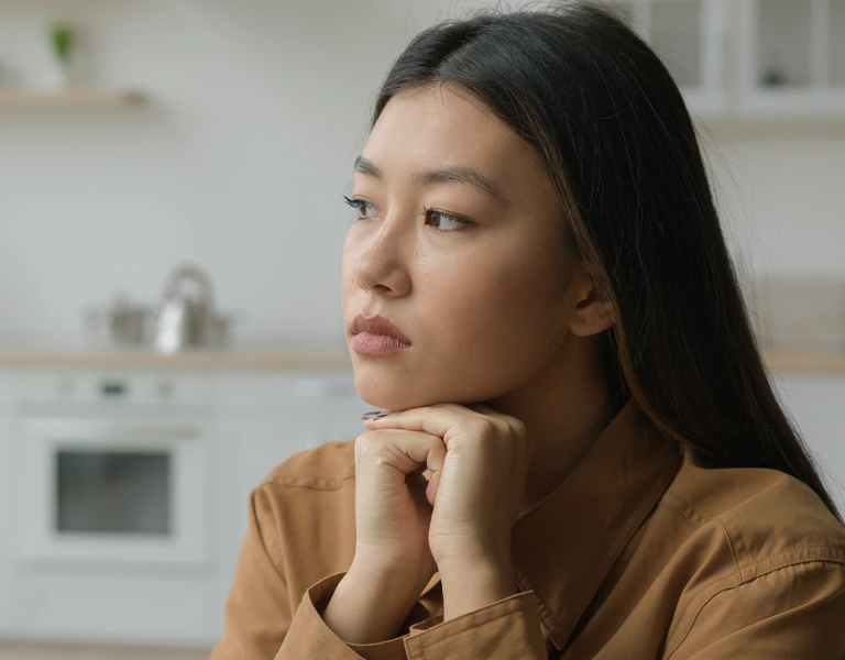 A lady thinking hard about how to prioritize her values