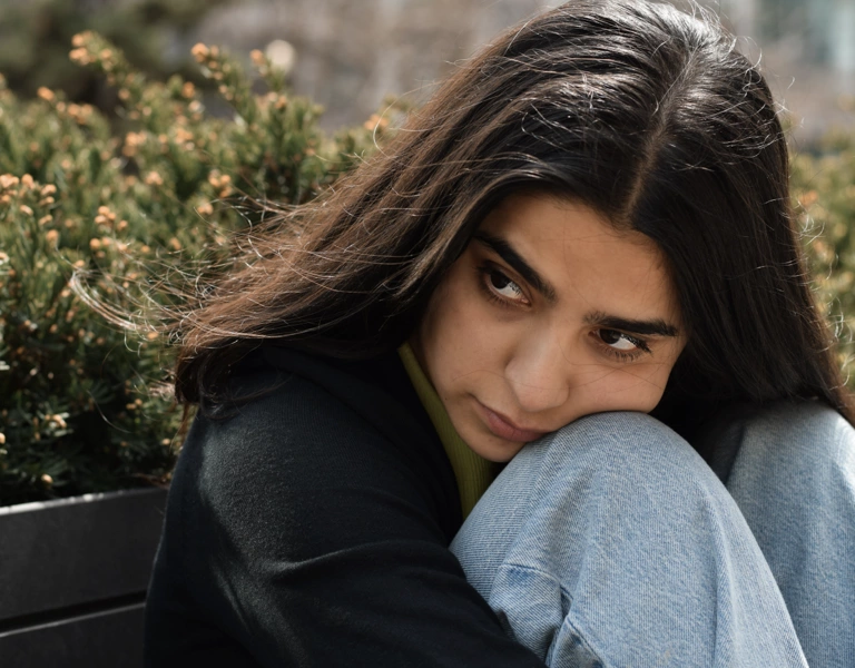 A teenage girl looking sad